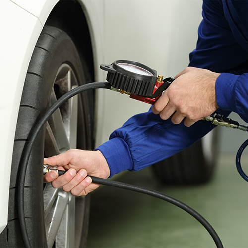 Checking tire pressure.