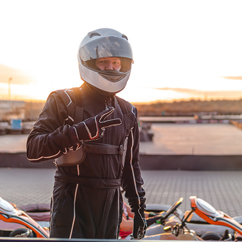 Racecar driver shows the peace sign