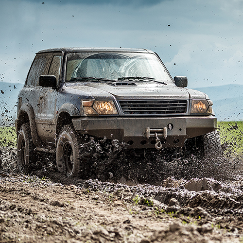 Light truck with flotational tires driving off-road